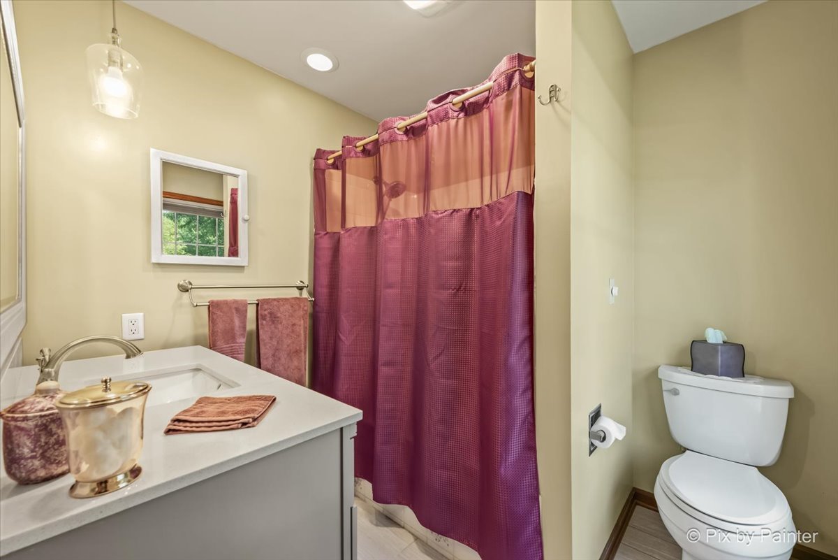 2N445 Beith Road Elburn, IL 60119 - Photo 23 of 58 a bathroom with a sink a toilet and shower curtain