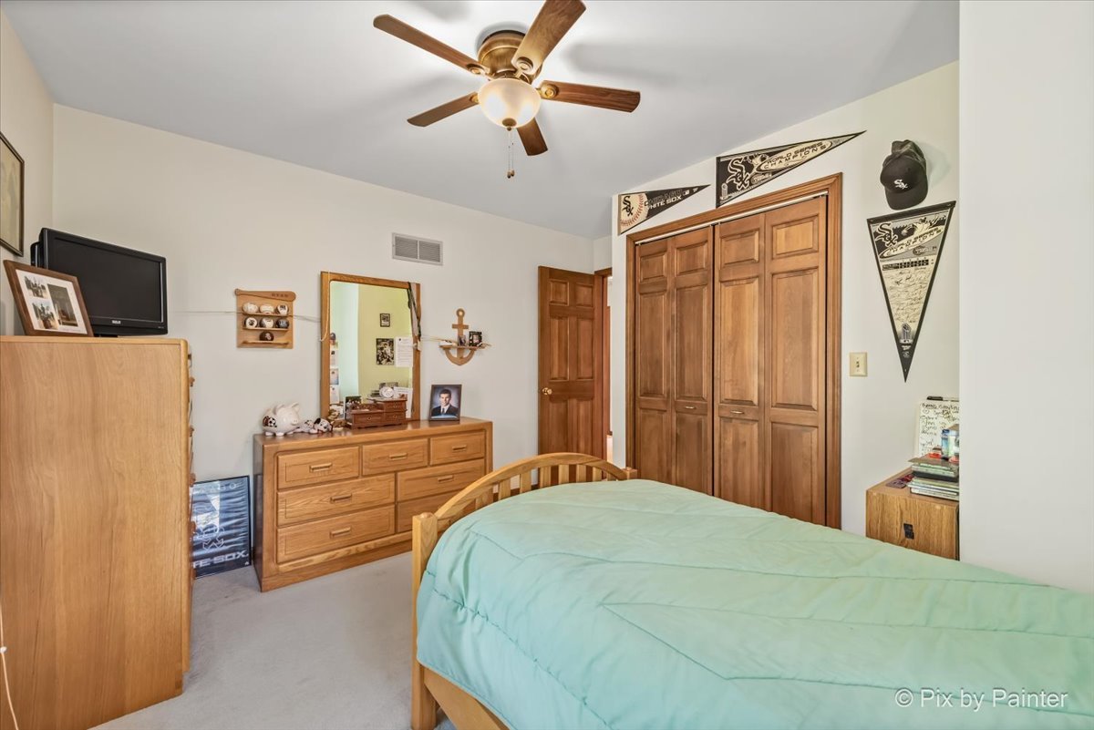 2N445 Beith Road Elburn, IL 60119 - Photo 26 of 58 a bedroom with a bed dresser and a window
