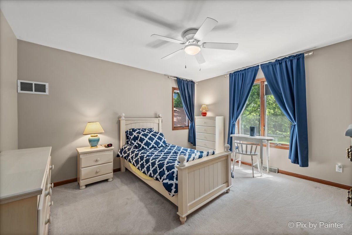 2N445 Beith Road Elburn, IL 60119 - Photo 27 of 58 a bedroom with a bed lamp and window