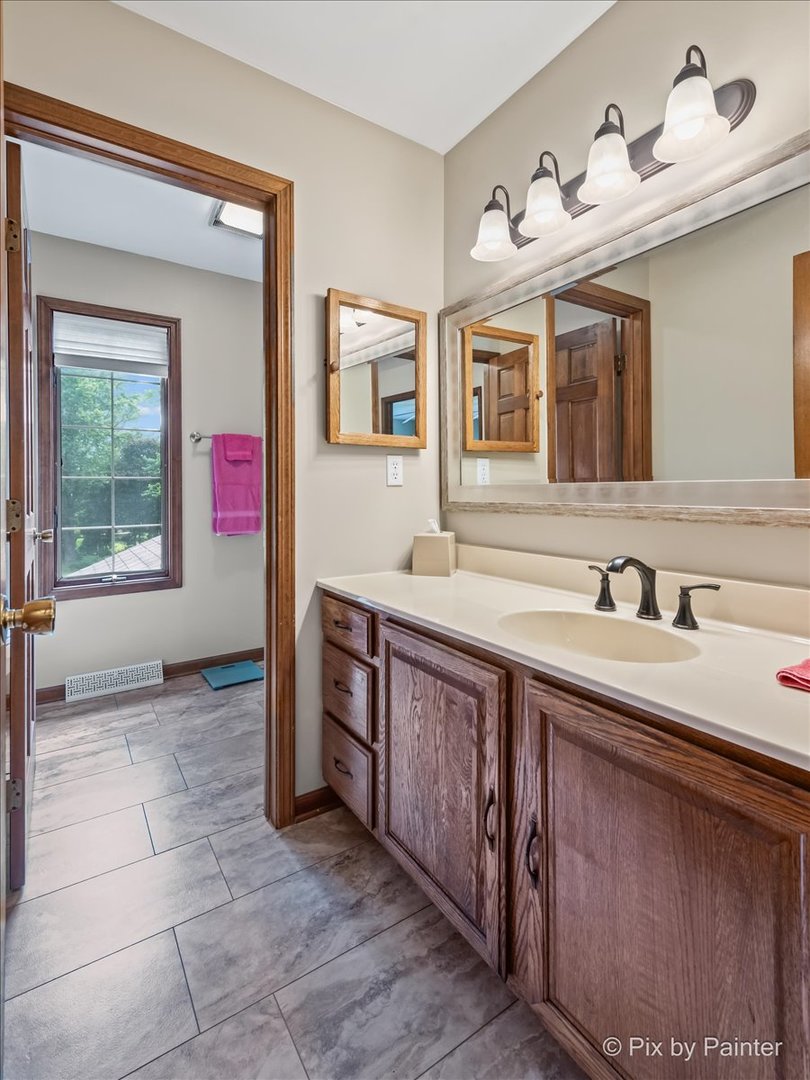 2N445 Beith Road Elburn, IL 60119 - Photo 31 of 58 a spacious bathroom with a sink and a mirror