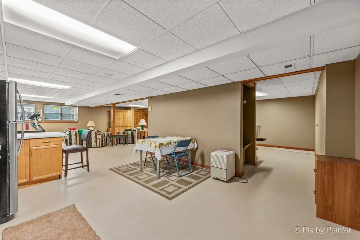 2N445 Beith Road Elburn, IL 60119 - Photo 37 of 58 a dining room with furniture and a kitchen view