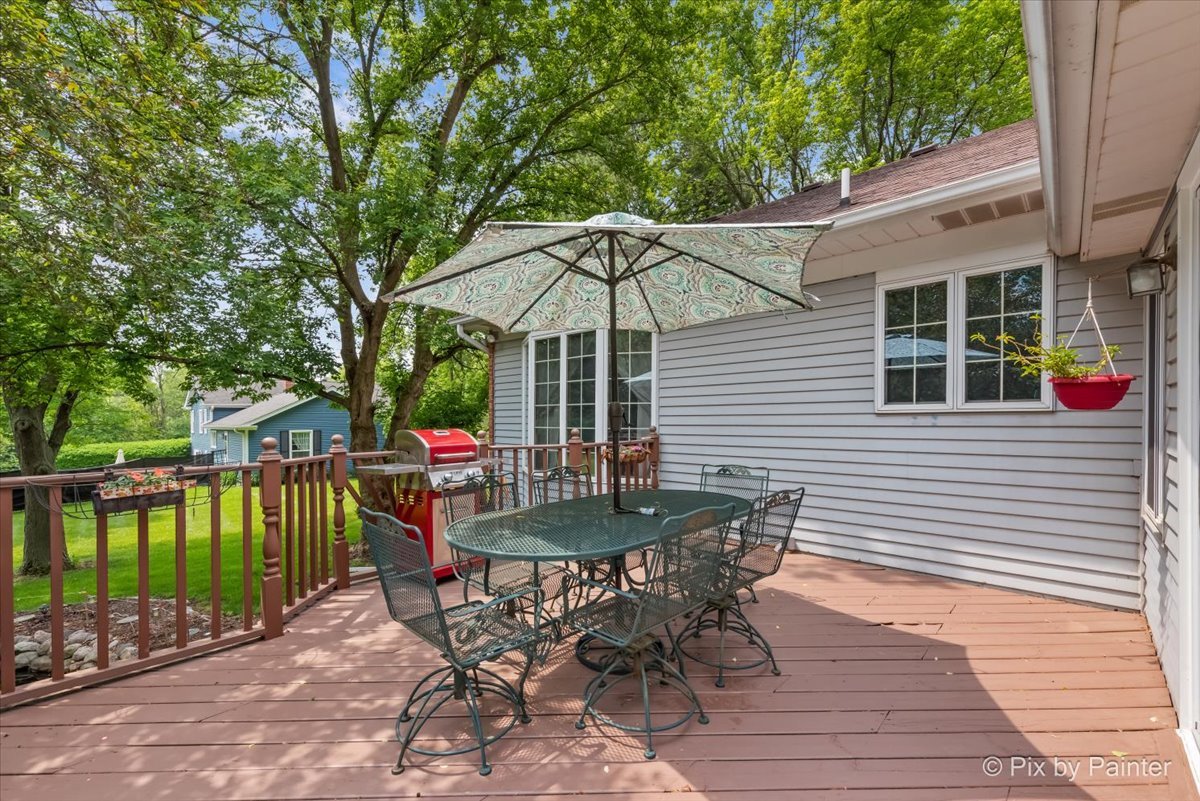 2N445 Beith Road Elburn, IL 60119 - Photo 40 of 58 a view of a chair and table on the wooden deck