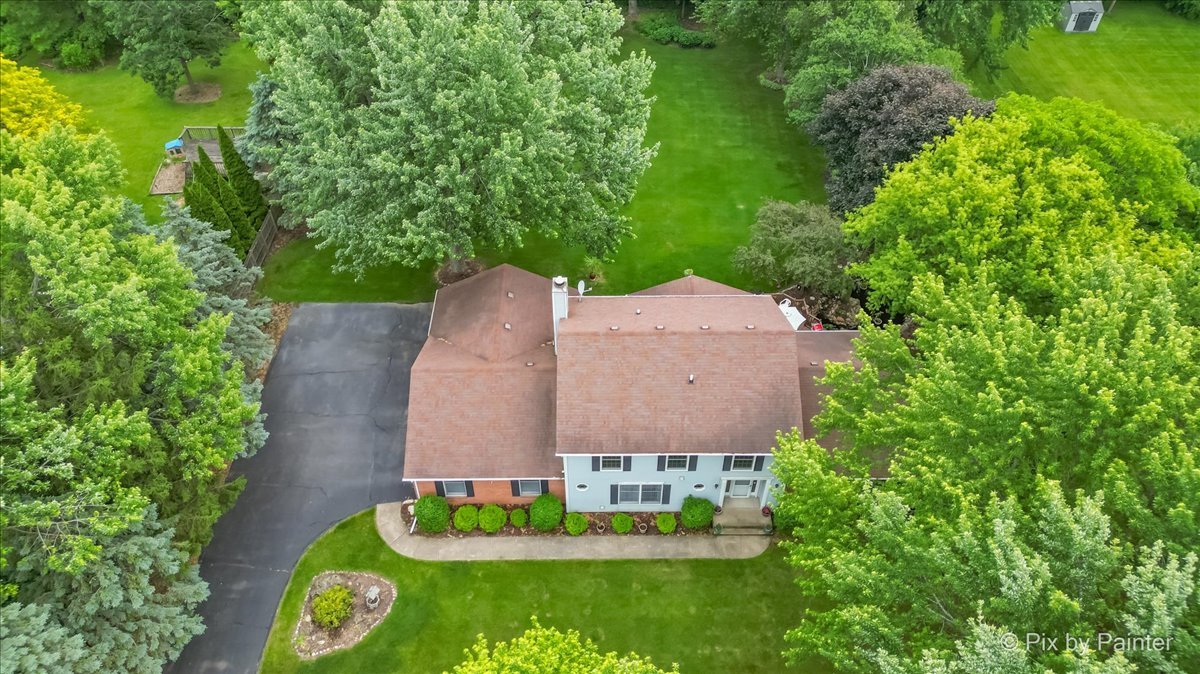 2N445 Beith Road Elburn, IL 60119 - Photo 49 of 58 an aerial view of a house with a garden and lake view