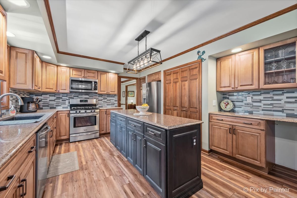 2N445 Beith Road Elburn, IL 60119 - Photo 6 of 58 a kitchen with stainless steel appliances granite countertop a stove a sink dishwasher and a refrigerator