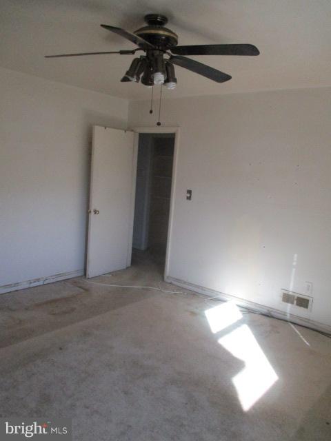 6125 Dunroming Road Baltimore, MD 21239 - Photo 11 of 21 a view of a room with a ceiling fan and window