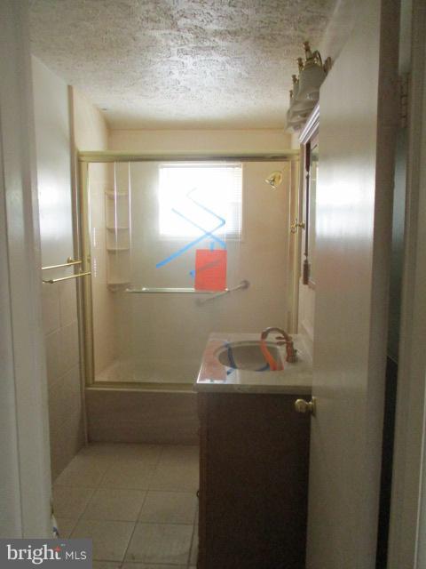 6125 Dunroming Road Baltimore, MD 21239 - Photo 12 of 21 a bathroom with a sink and a mirror