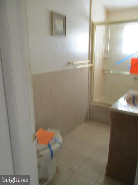 6125 Dunroming Road Baltimore, MD 21239 - Photo 13 of 21 a bathroom with a shower