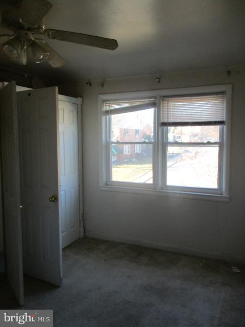 6125 Dunroming Road Baltimore, MD 21239 - Photo 15 of 21 a view of an empty room with a window