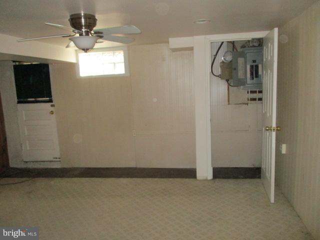 6125 Dunroming Road Baltimore, MD 21239 - Photo 19 of 21 a view of a livingroom with an empty space and a window