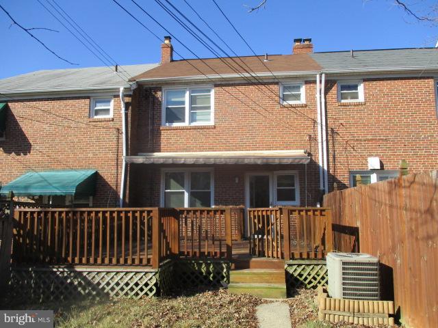 6125 Dunroming Road Baltimore, MD 21239 - Photo 21 of 21 a view of a house with a wooden fence