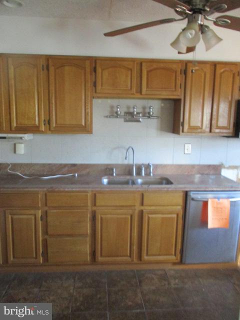 6125 Dunroming Road Baltimore, MD 21239 - Photo 7 of 21 a kitchen with stainless steel appliances granite countertop a sink a stove and cabinets