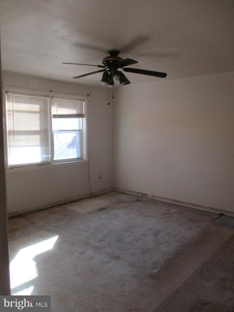 6125 Dunroming Road Baltimore, MD 21239 - Photo 10 of 21 an empty room with windows and fan