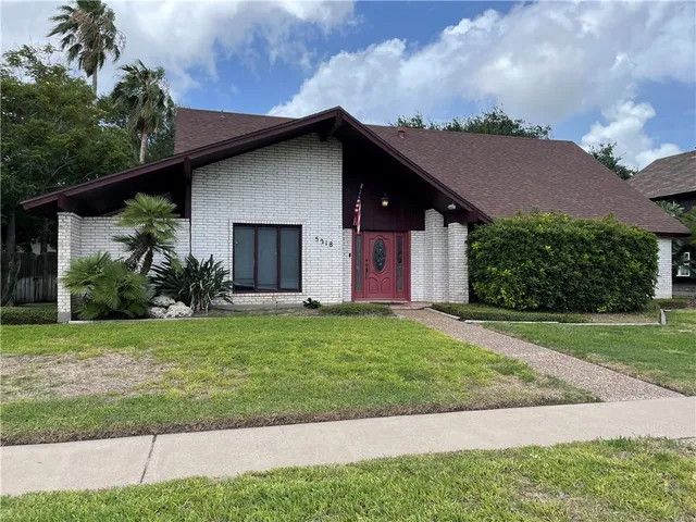 a house with garden in front of it