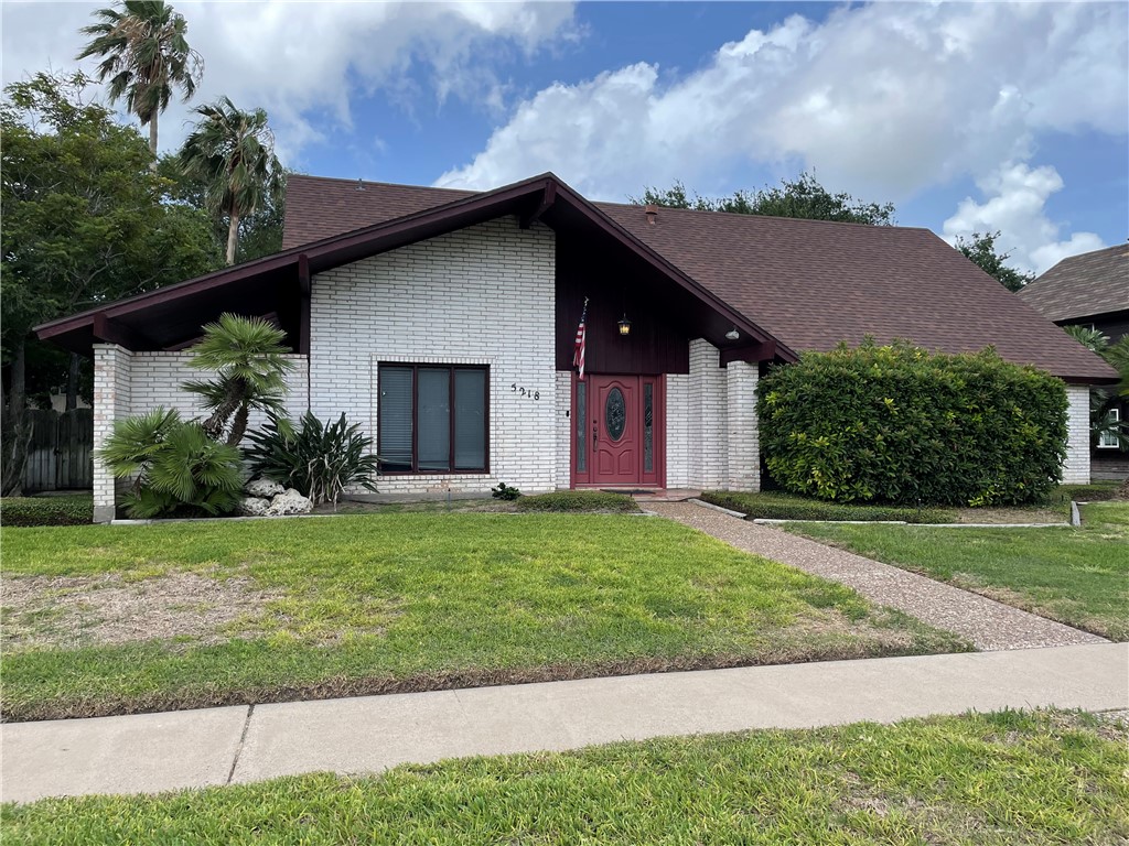 a house with garden in front of it