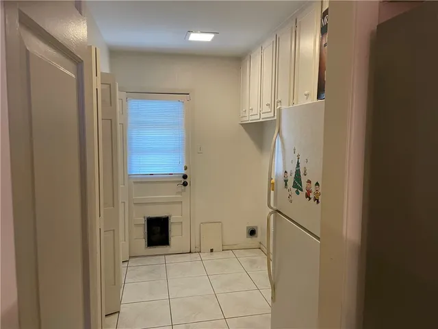 a view of a livingroom with an empty space and a fireplace