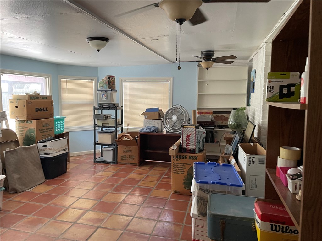 5218 Wooldridge Road Corpus Christi, TX 78413 - Photo 14 of 29 a living room with furniture and a flat screen tv