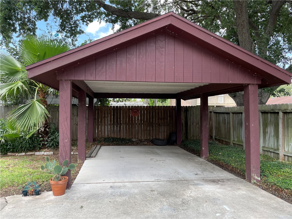 5218 Wooldridge Road Corpus Christi, TX 78413 - Photo 26 of 29 a wooden house with a trees in the background