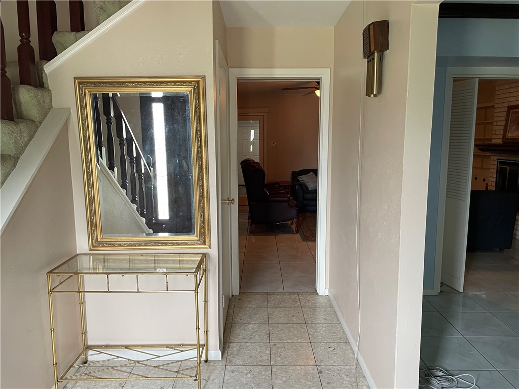 5218 Wooldridge Road Corpus Christi, TX 78413 - Photo 3 of 29 a view of hallway with mirror and furniture