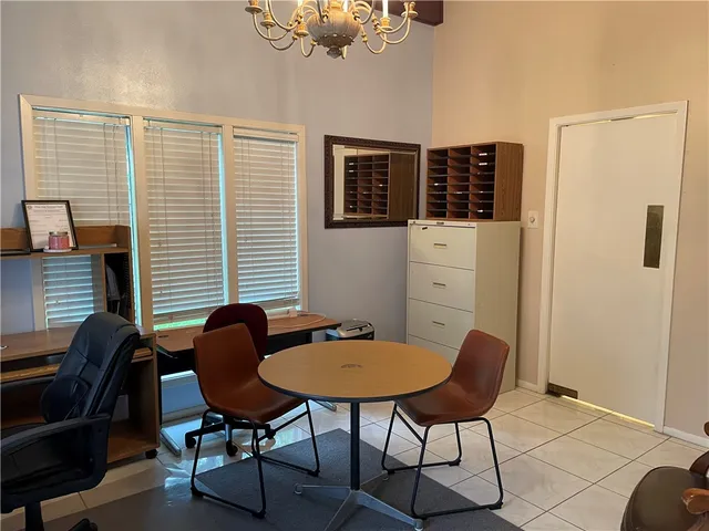 a view of a workspace with furniture