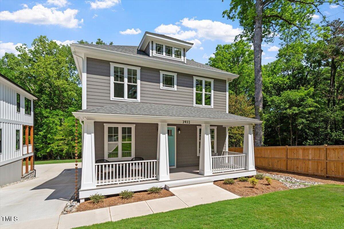 3932 Old Chapel Hill Road Durham, NC 27707 - Photo 8 of 46 a front view of a house with a garden
