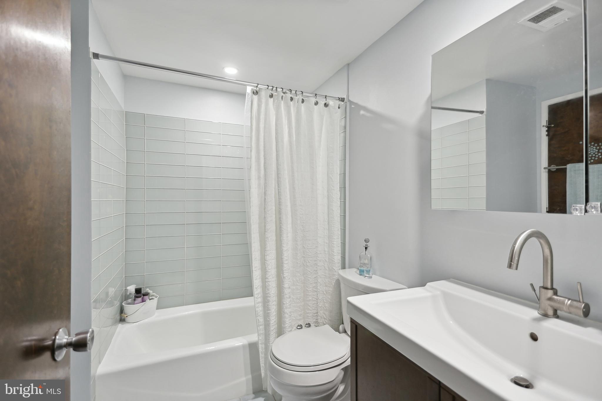 1801 Park Road Northwest, Unit 1 Washington, DC 20010 - Photo 10 of 25 Cheerful bathroom with new updates and glass tile!