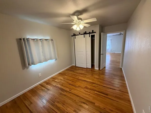 a view of a livingroom with wooden floor