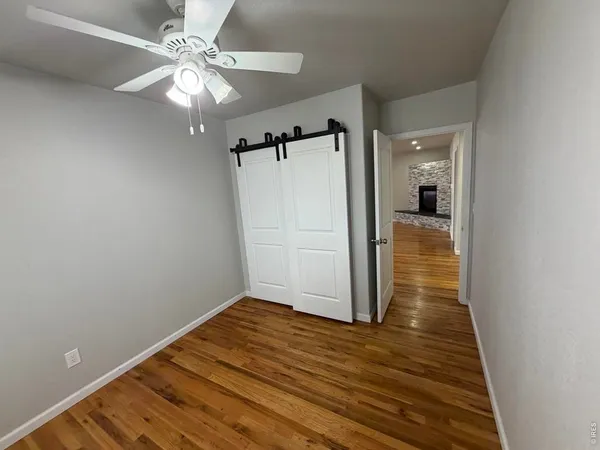a view of a livingroom with wooden floor