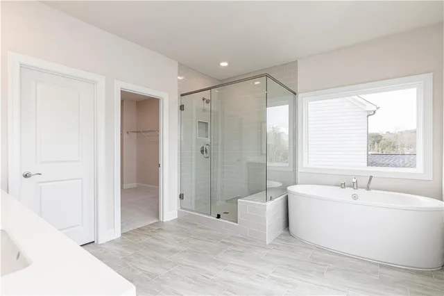 a bathroom with a bathtub and a sink