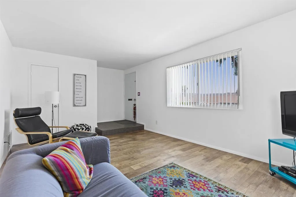 7883 Rancho Fanita Drive, Unit A Santee, CA 92071 - Photo 11 of 27 a living room with furniture and a flat screen tv