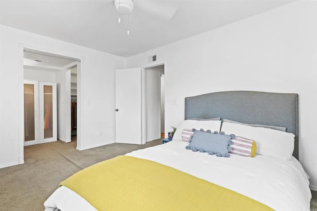 7883 Rancho Fanita Drive, Unit A Santee, CA 92071 - Photo 15 of 27 a bed room with a bed and a chair