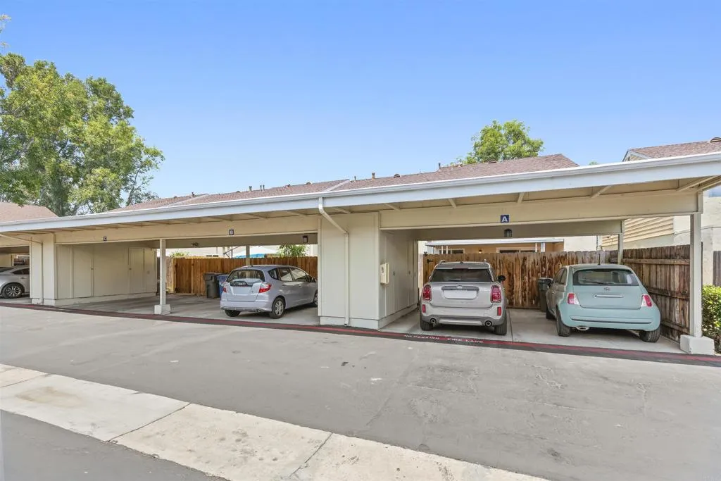7883 Rancho Fanita Drive, Unit A Santee, CA 92071 - Photo 25 of 27 a view of a garage with parked cars