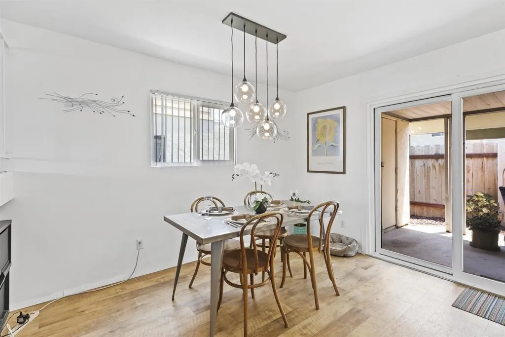 7883 Rancho Fanita Drive, Unit A Santee, CA 92071 - Photo 6 of 27 a view of a dining room with furniture and wooden floor