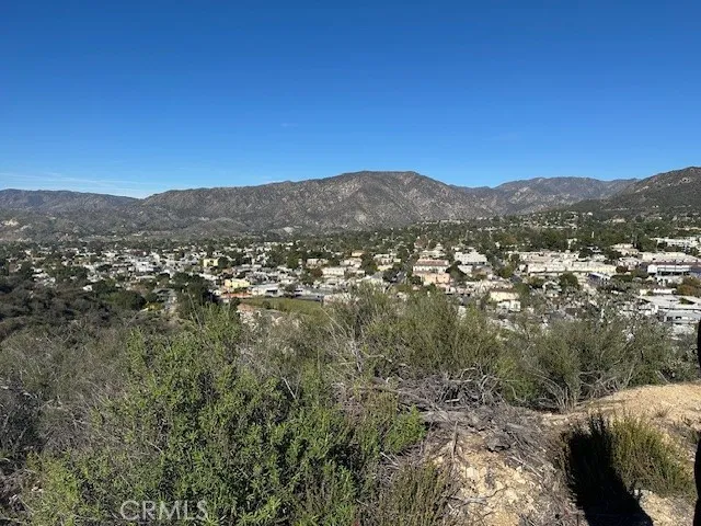 a view of a city with mountains in the background