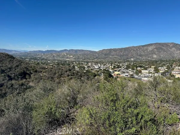 a view of a city with mountains in the background