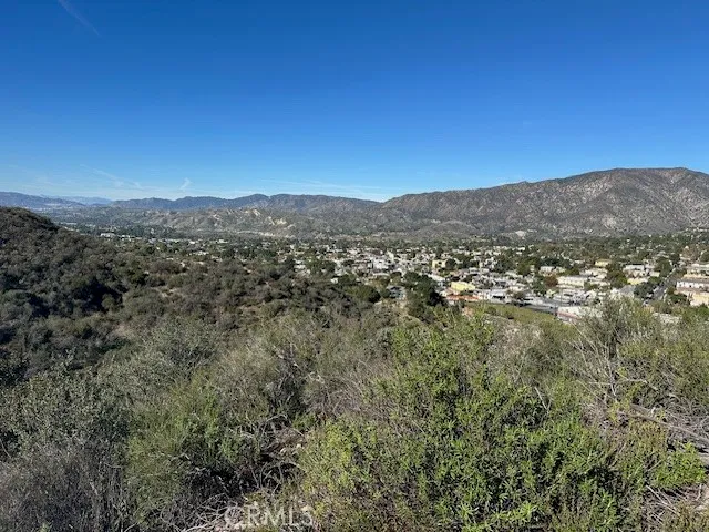a view of a city with mountains in the background