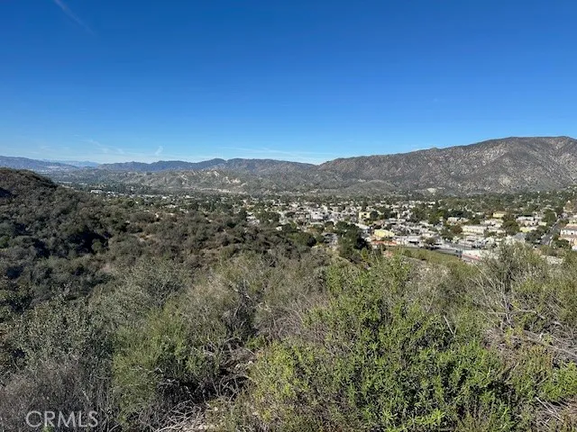 a view of a city with mountains in the background