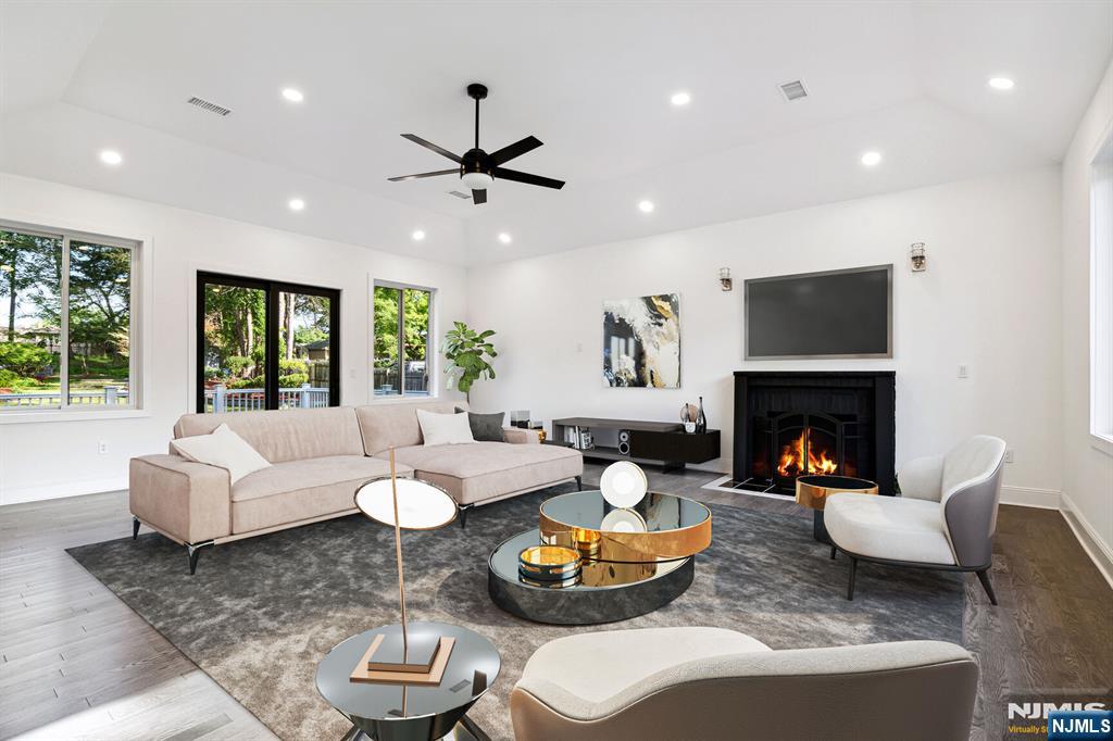 291 Tappan Road Norwood, NJ 07648 - Photo 12 of 26 a living room with furniture and a fireplace