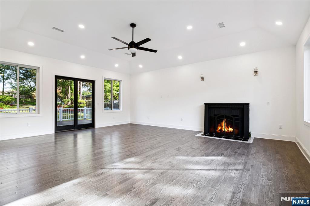 291 Tappan Road Norwood, NJ 07648 - Photo 13 of 26 a view of an empty room with a fireplace and a window