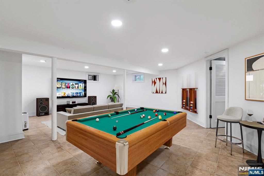 291 Tappan Road Norwood, NJ 07648 - Photo 25 of 26 a living room with furniture pool table and a flat screen tv