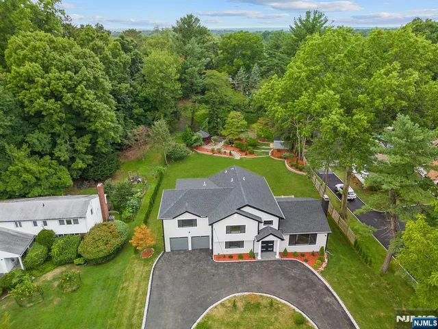 an aerial view of a house with garden