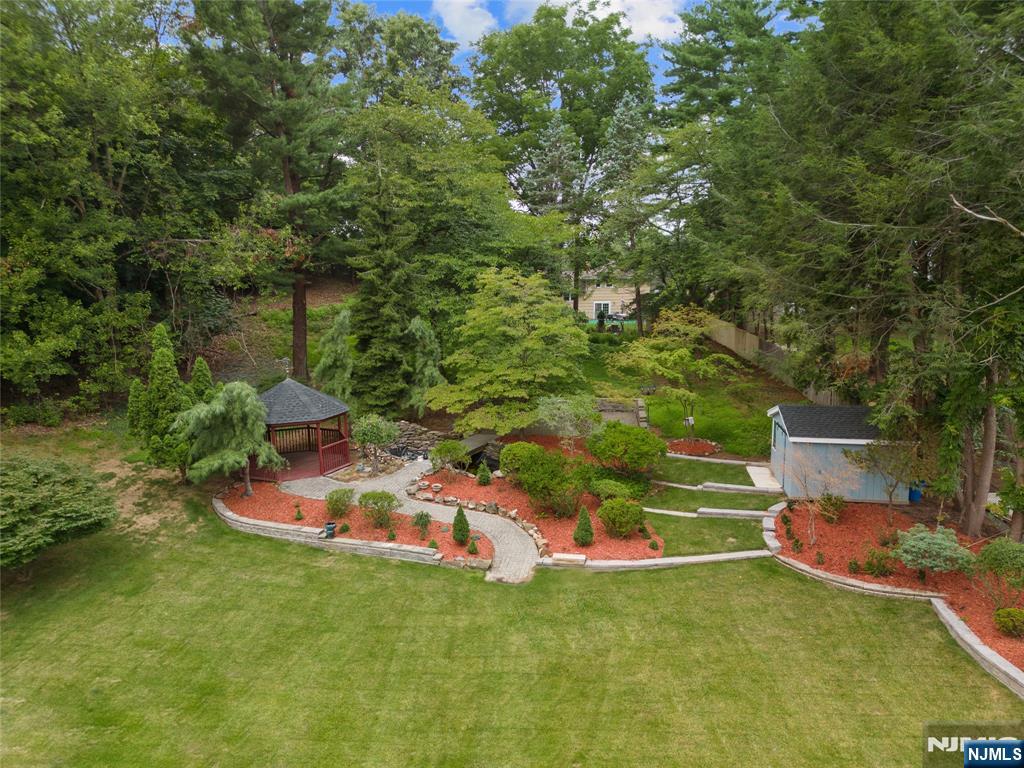 291 Tappan Road Norwood, NJ 07648 - Photo 5 of 26 a backyard of a house with table and chairs