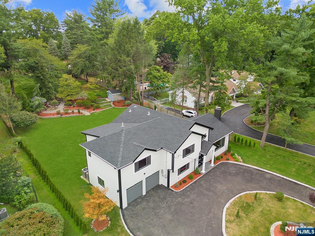 291 Tappan Road Norwood, NJ 07648 - Photo 6 of 26 an aerial view of a house with swimming pool and a yard