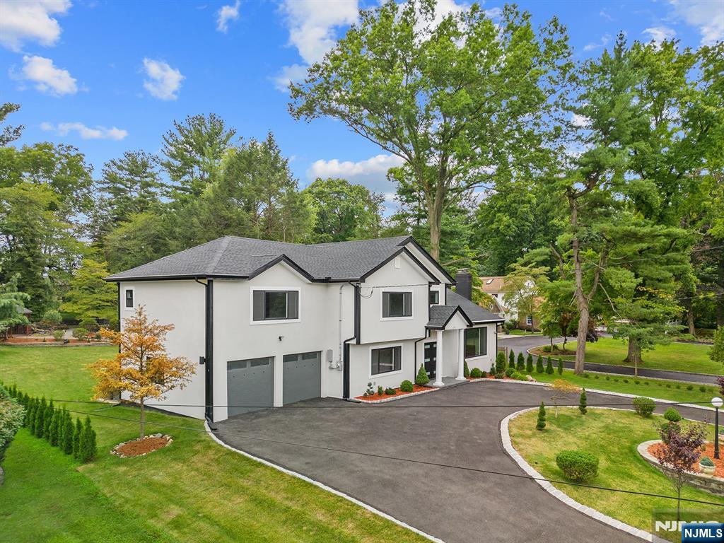 291 Tappan Road Norwood, NJ 07648 - Photo 7 of 26 a view of a house with a swimming pool