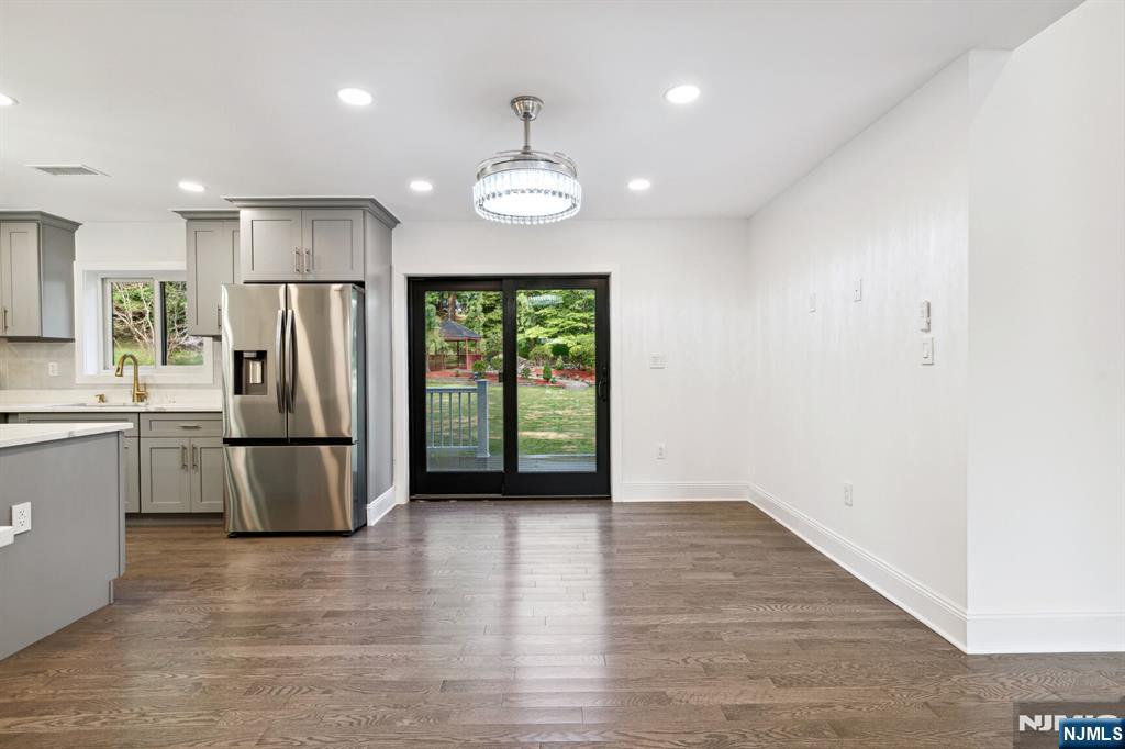 291 Tappan Road Norwood, NJ 07648 - Photo 9 of 26 a view of kitchen with refrigerator and wooden floor