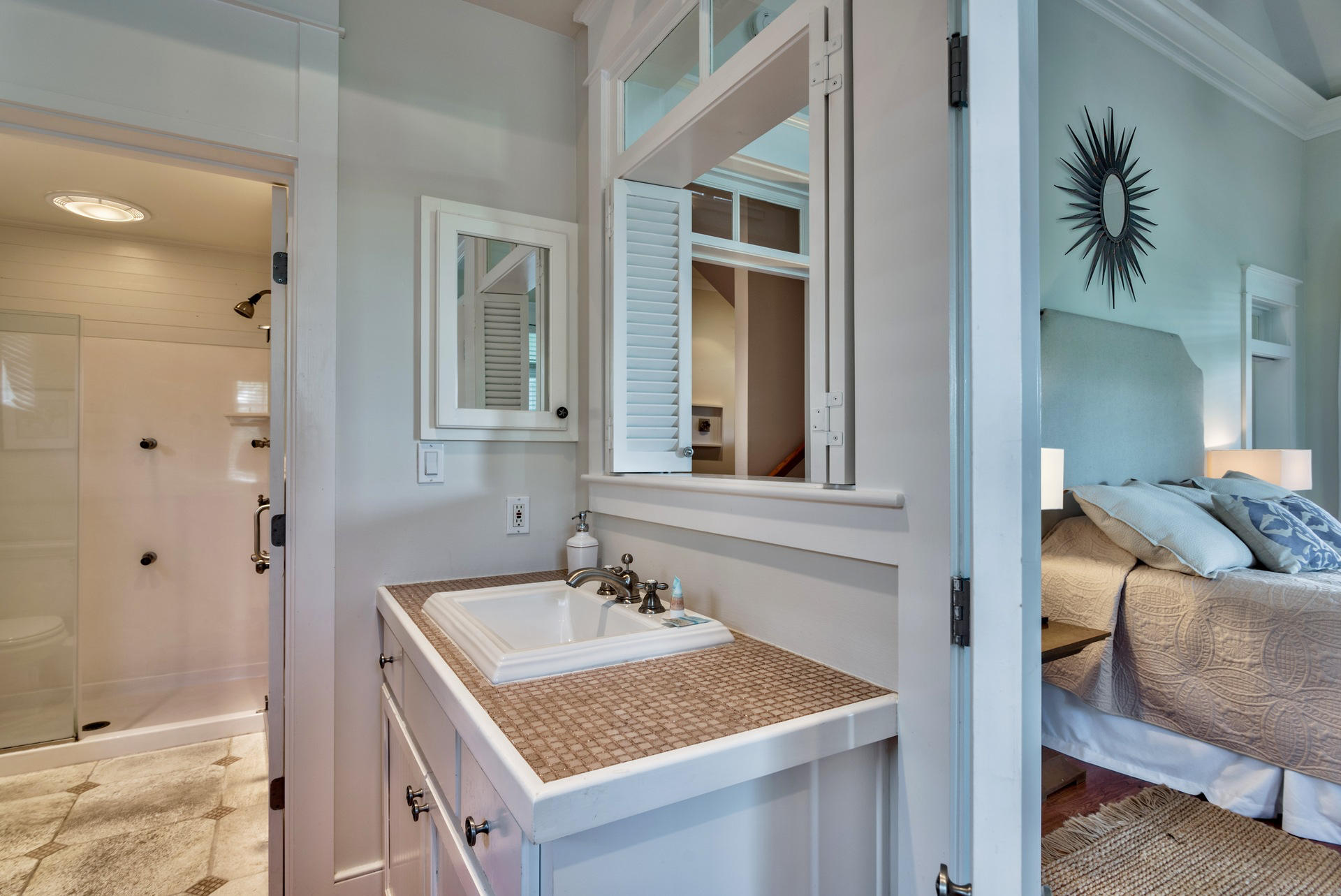 54 Round Road Rosemary Beach, FL 32461 - Photo 24 of 48 a bathroom with a granite countertop sink and a mirror