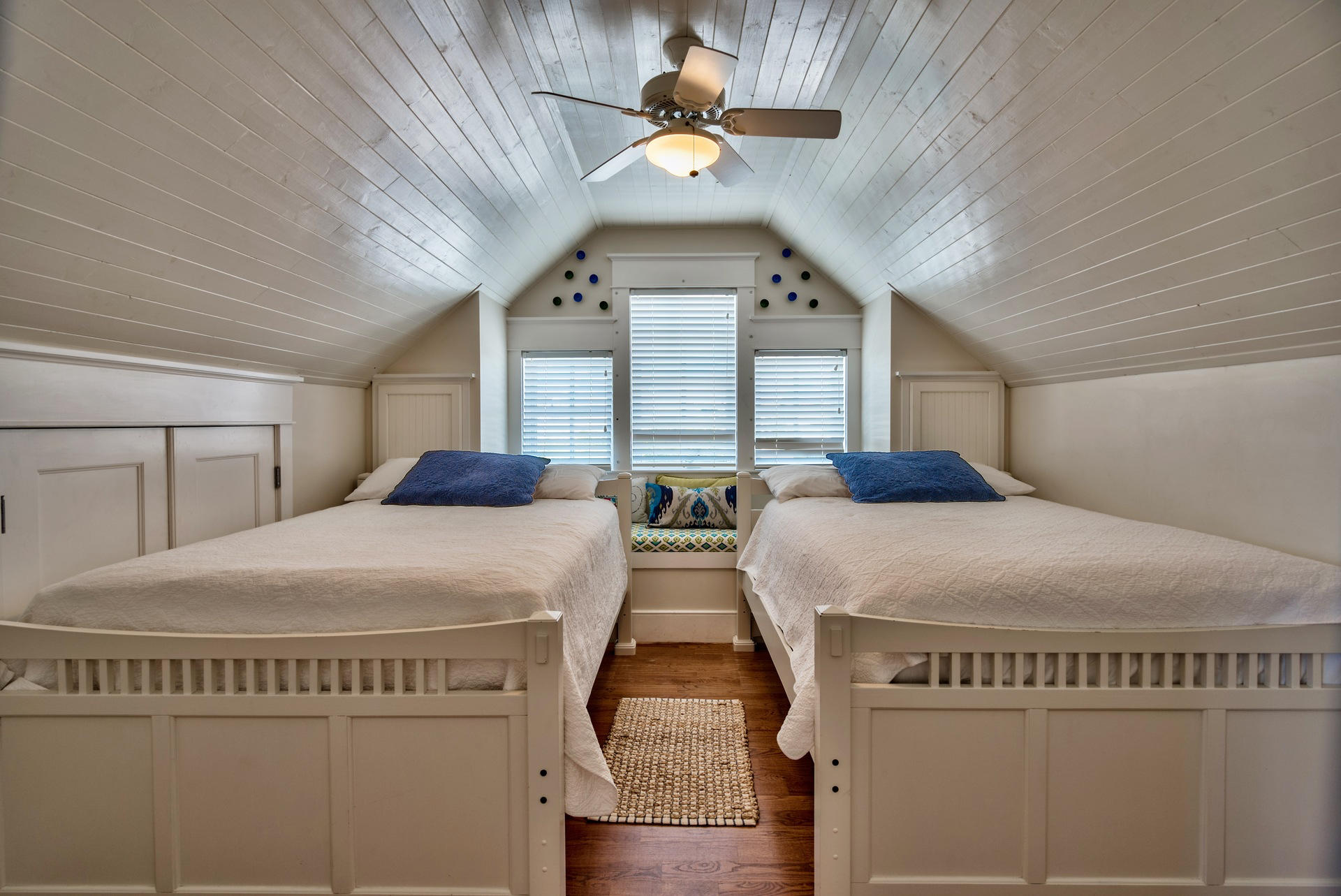54 Round Road Rosemary Beach, FL 32461 - Photo 33 of 48 a bedroom with two beds and a chandelier