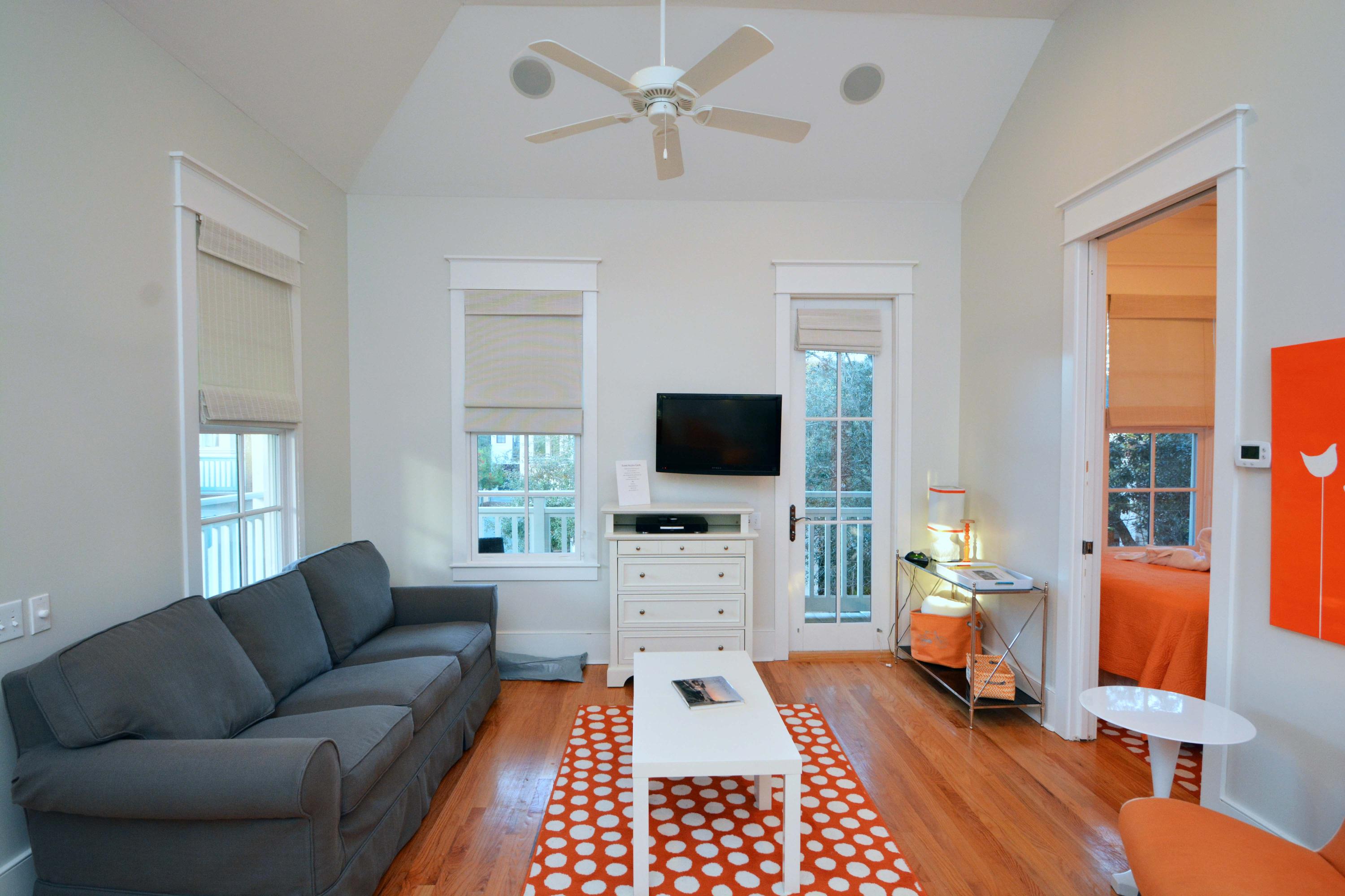 54 Round Road Rosemary Beach, FL 32461 - Photo 36 of 48 a living room with furniture a flat screen tv and a window