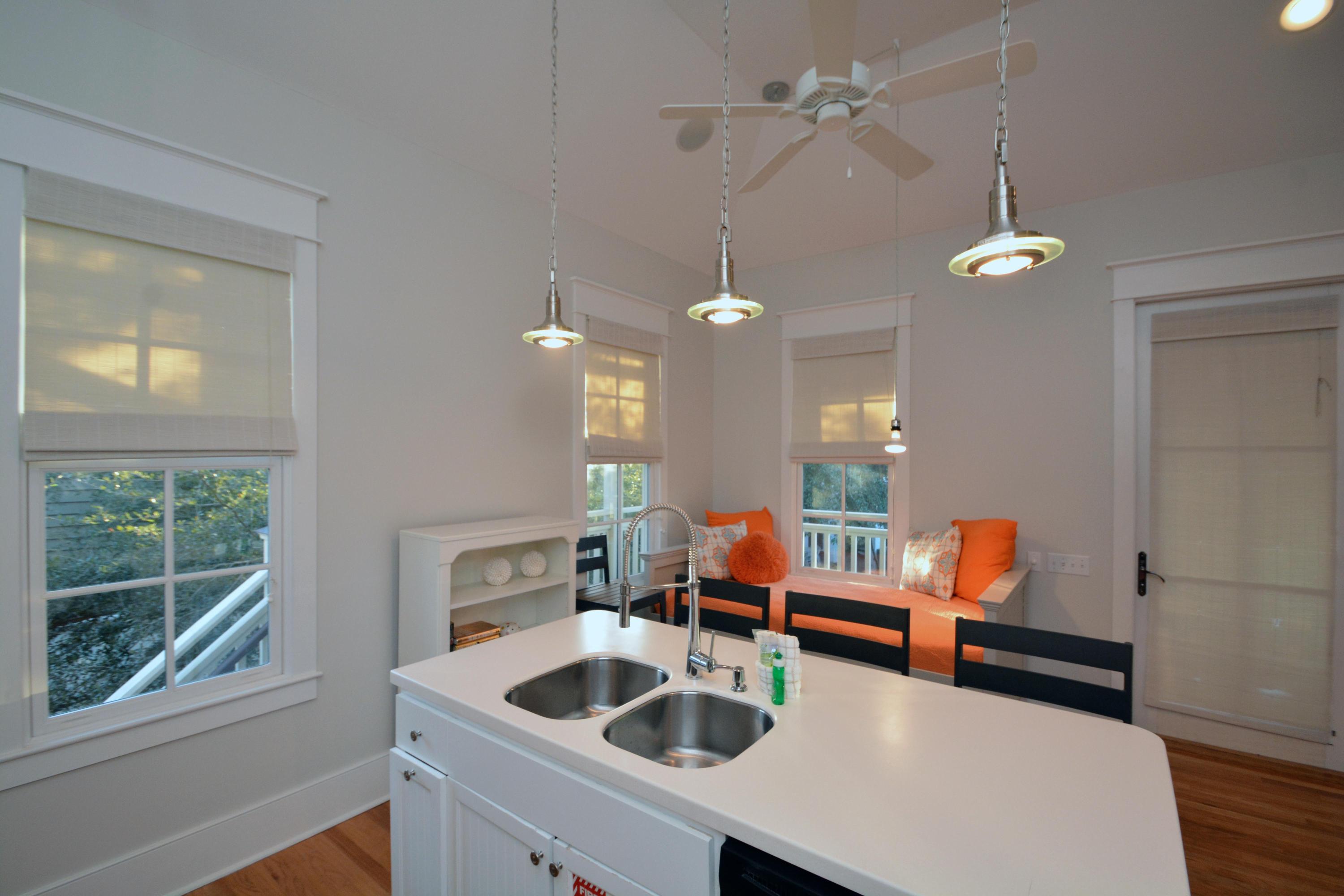 54 Round Road Rosemary Beach, FL 32461 - Photo 38 of 48 a kitchen with stainless steel appliances kitchen island a stove a sink and a refrigerator