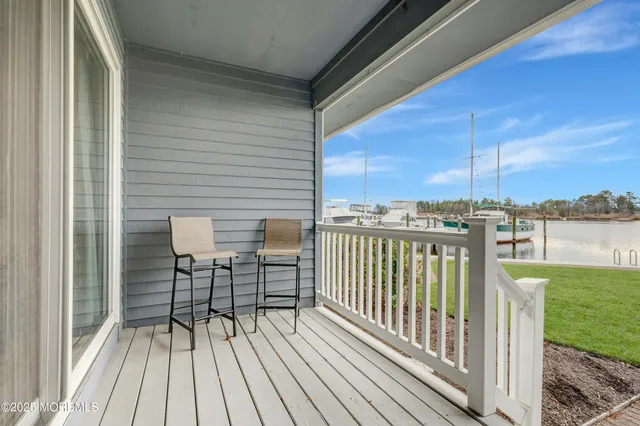 a view of a deck with a big yard