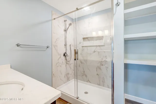 a front view of a house with garden and houses